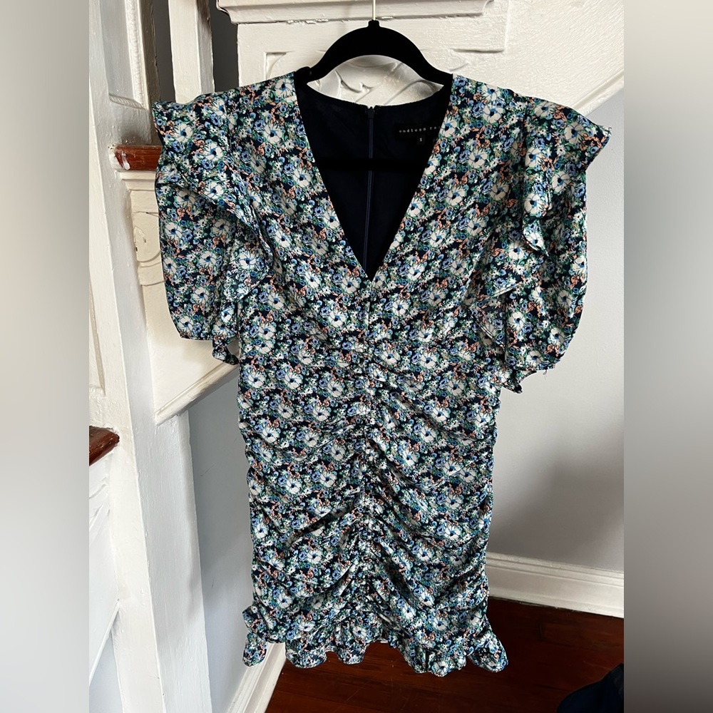 Endless rose mini dress with blue, white, green and peach floral pattern.